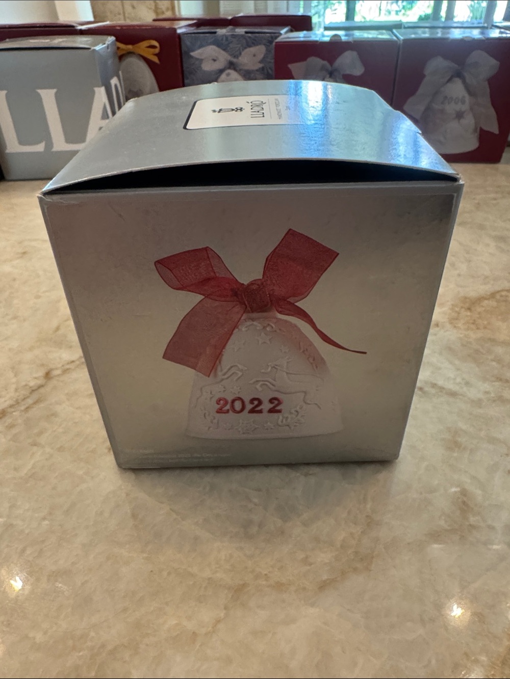 Lladro Porcelain Bell Ornament with Red Bow and Raised Motifs